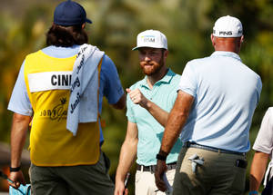 Chris Kirk Fist Bump With Caddie Wallpaper