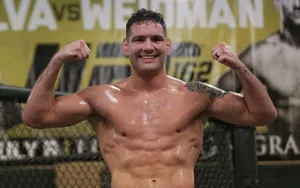 Chris Weidman Flexing Biceps Wallpaper