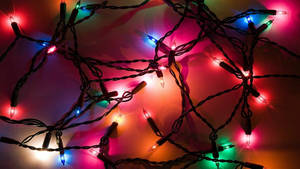 Christmas Lights On A Dark Background Wallpaper