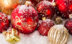 Christmas Ornaments In The Snow Wallpaper