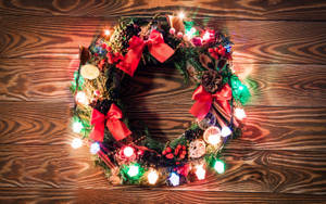 Christmas Wreath With Colorful Lights Wallpaper