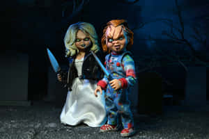 Chuckyand Bride Dolls With Knives Wallpaper