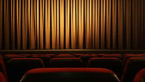 Cinema_ Theater_ Interior_with_ Curtains_and_ Seats Wallpaper