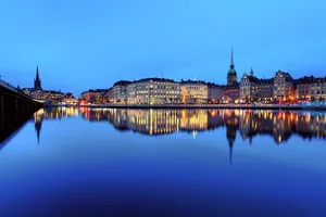 City Of Stockholm Reflecting Water Wallpaper