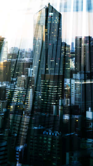 Cityscape Reflectionsat Dusk Wallpaper