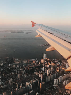 Cityscape View In Airplane Wallpaper