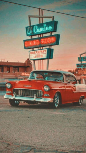 Classic Car With Vintage Phone - A Blend Of History Wallpaper