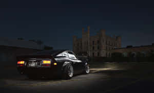 Classic Datsun Car In Vibrant Blue Wallpaper