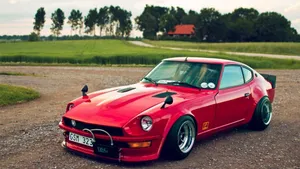Classic Datsun On Open Road Wallpaper
