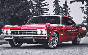Classic Shine Of A 1967 Chevrolet Impala In Metallic Red Wallpaper
