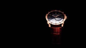 Classy Bvlgari Watch Black Background Wallpaper