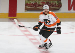 Claude Giroux In Action During An Nhl Game Wallpaper