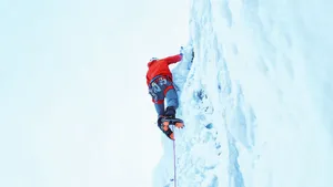 Climbing In Bright Red Jacket Wallpaper