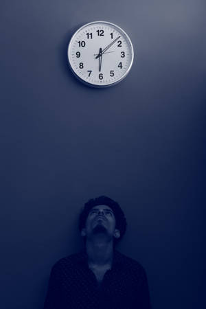 Clock With A Lonely Man Wallpaper