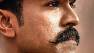 Close-up Of Ram Charan Showcasing Brilliant Expressions In Hd Wallpaper