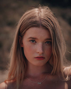 Close-up Shot Of A Blonde Teenage Girl Wallpaper