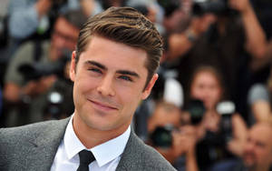 Close-up Smile Of Zac Efron Wallpaper