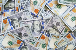 Closeup Bluish 100 Dollar Bill Pile Wallpaper