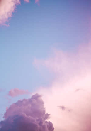 Clouds Of Pink And Blue Take Over The Sky Wallpaper