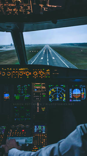 Cockpit And Pilot On Runway Wallpaper