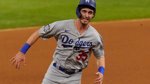 Cody Bellinger Running In Baseball Field Wallpaper