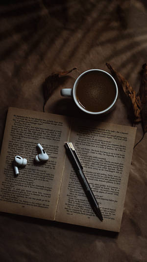 Coffee Cup With A Book Wallpaper