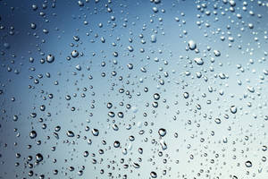 Cold Raindrops On Crystal Glass Surface Wallpaper