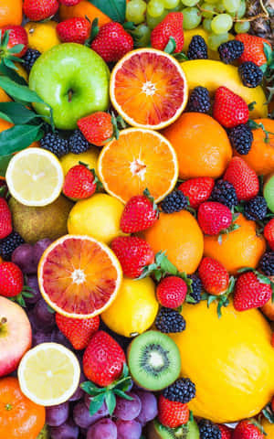 Colorful Citrus Fruitsand Berries Mix Wallpaper