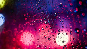 Colorful Raindrops On A Glass Surface Wallpaper