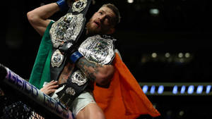 Conor Mcgregor With Two Ufc Belts Wallpaper