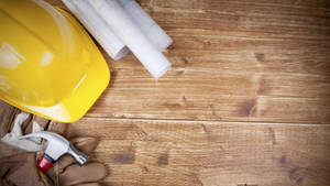 Construction Tools On A Wooden Surface Wallpaper