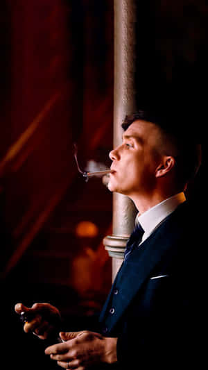 Contemplative Man Smoking Wallpaper