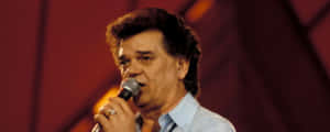 Conway Twitty Performingon Stage.jpg Wallpaper