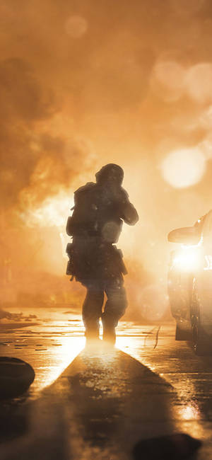Cool Call Of Duty Modern Warfare Iphone Walking Towards Fiery Battle Wallpaper