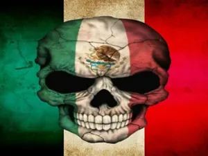 Cool Mexican Riding A Horse Through Sunset Wallpaper