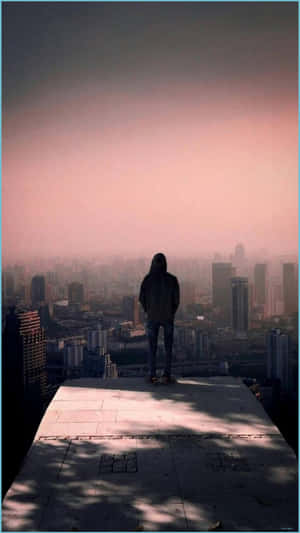 Cool Sad Boy Overlooking The City Wallpaper