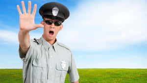 Cop Police Officer With Stop Hand Gesture Wallpaper
