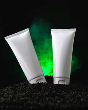 Cosmetic Tubes Mockup Green Backdrop Wallpaper