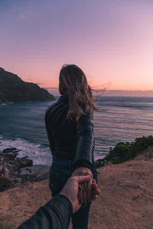 Couple Hands Ocean Cliffside Wallpaper