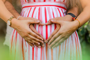 Couple Hands Pregnant Belly Wallpaper