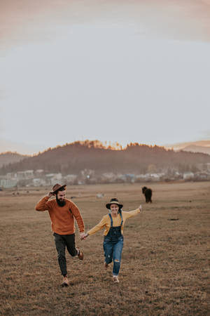 Couple In Cowboy Costume Wallpaper