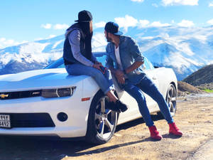 Couple In Love On A White Chevrolet Wallpaper