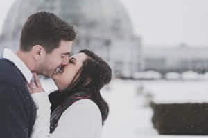 Couple Kissing Lips On Snow Wallpaper