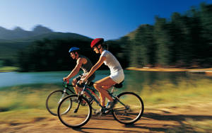 Couple On Bike Ride Wallpaper