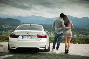 Couple With White Bmw M4 Wallpaper