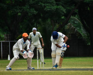 Cricket Rivals Blue And Orange Wallpaper