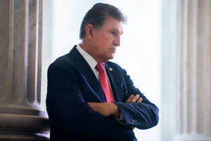 Cross-armed Joe Manchin Wallpaper