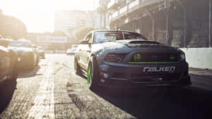 Cruise Through The City Streets In A Luxury Sports Car Wallpaper