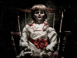 Cursed Annabelle Doll On Chair Wallpaper