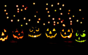 Cute Aesthetic Halloween Glowing Jack-o'-lanterns Wallpaper